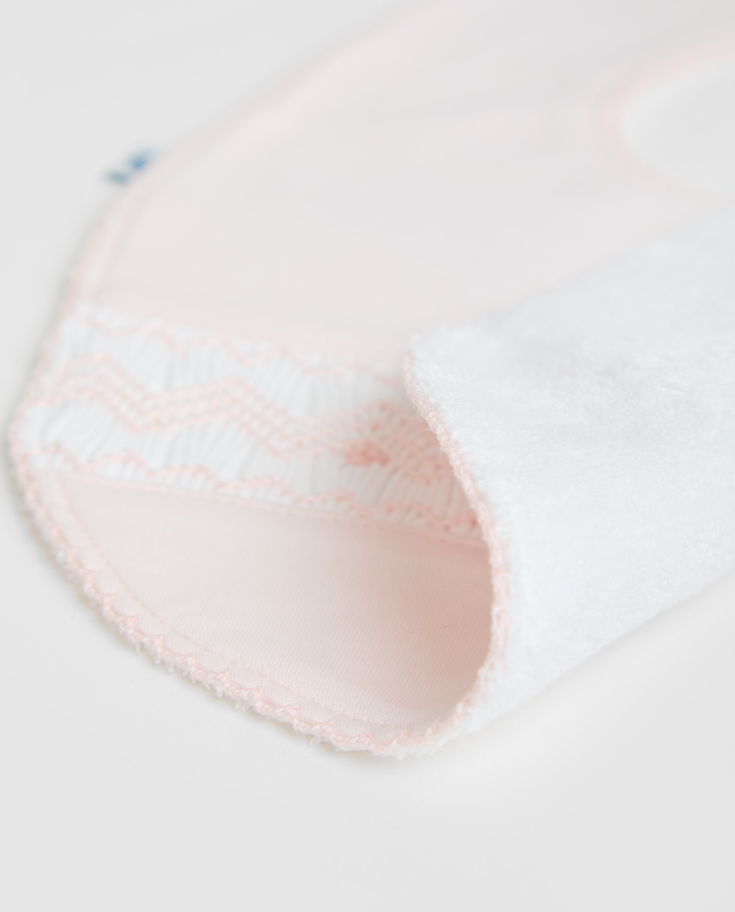 Bavoir rose à smocks