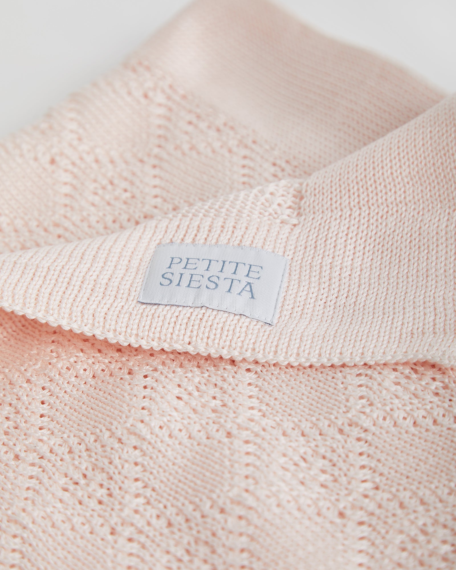 Couverture en coton perlé rose 