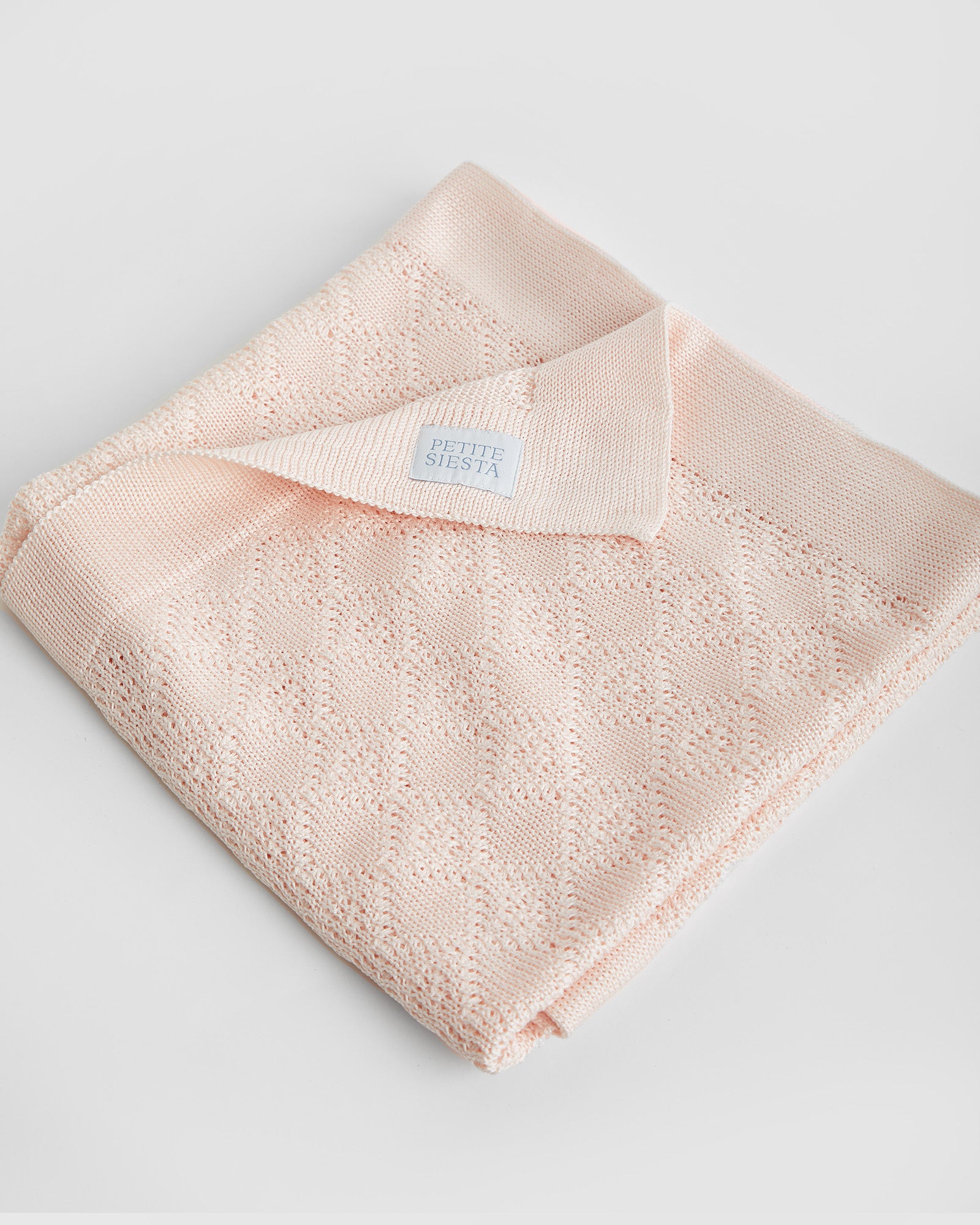 Couverture en coton perlé rose 